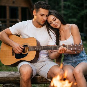 hyper‑realistic photograph, 9:16, intimate campfire scene: мужчина в белой футболке и светло‑серых шортах сидит на скамье с акустической гитарой на коленях, женщина в белой майке на тонких бретелях и джинсовых шортах прислонила голову к его плечу и смотри