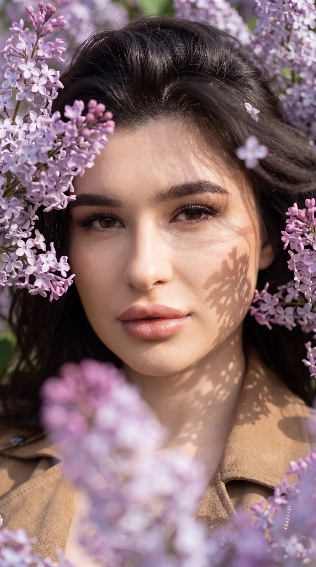 Without changing facial features.
Close-up portrait of a girl looking directly into the camera through dense blooming lilac branches. Some flowers in the foreground are out of focus, creating a sense of depth and soft blurred lilac-purple spots. Pose and 
