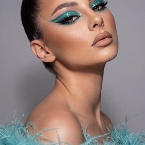 A girl captured in a high-end beauty editorial close-up portrait. The shot mimics professional studio photography with high sharpness and detailed skin texture.

Pose and Angle: The image is a tight head-and-shoulders crop. Her head is tilted back and ang
