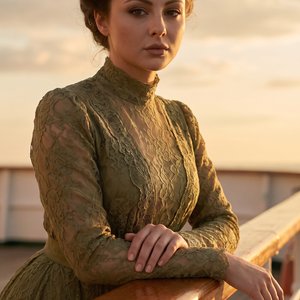 2)
Use the uploaded SCENE REFERENCE image as an ABSOLUTE STRICT reference for:

• composition  
• pose  
• framing  
• railing position  
• historical clothing  
• hairstyle  
• facial expression mood  
• lighting  
• sky background  
• camera angle  
• b