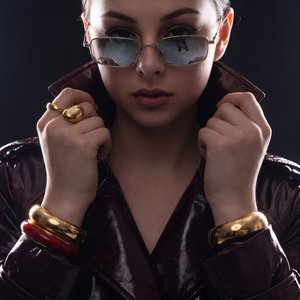 A girl, rim lighting, contour lighting, dual strip softboxes from behind, dark studio background, glowing outline, moody athletic studio shoot, isolated subject, highly detailed textures, ultra-crisp