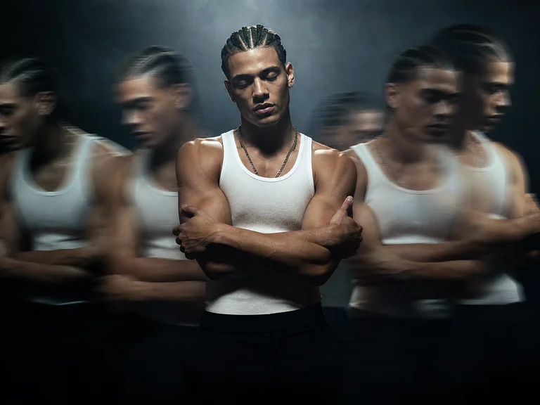 A cinematic fashion portrait of a young stylish