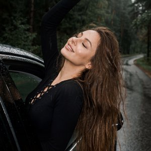 2014 iPhone 4 camera aesthetic, vintage Tumblr + Pinterest mood, soft flash photography, natural imperfections, slight grain, cinematic rainy atmosphere.

3:4 aspect ratio, emotional cinematic composition.

A scene of a car driving on a forest road on a r