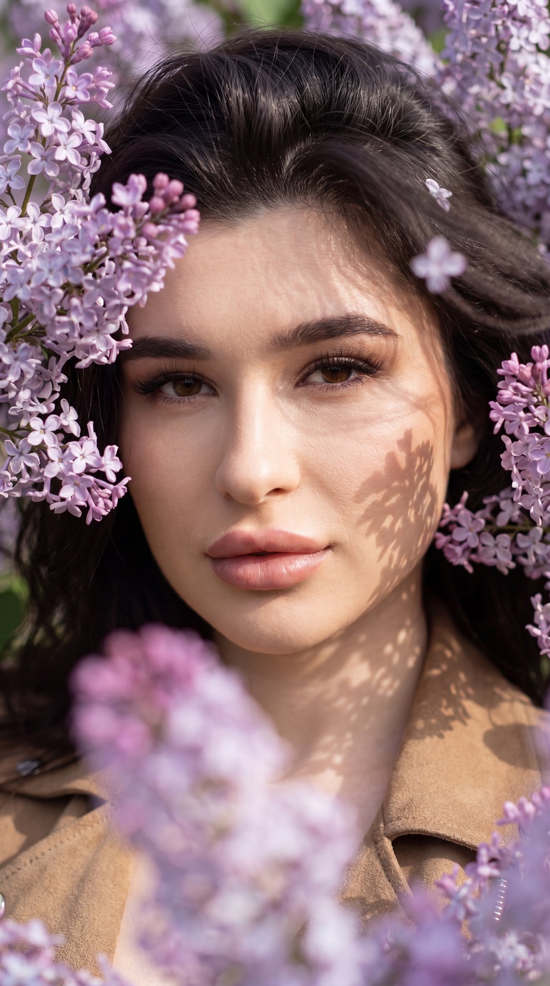 Without changing facial features.
Close-up portrait of a girl looking directly into the camera through dense blooming lilac branches. Some flowers in the foreground are out of focus, creating a sense of depth and soft blurred lilac-purple spots. Pose and 
