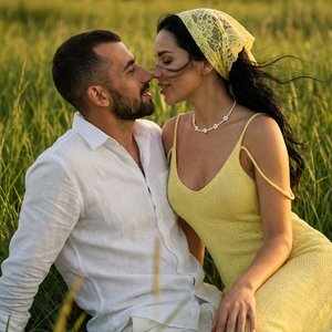 Use the uploaded photo as the exact identity reference for both faces. Keep both faces identical to the input image (same facial structure, eyes, lips, skin tone and proportions).

In the frame there are only two people — a man and a woman. The scene is c