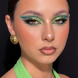 A girl captured in a high-end, close-up beauty editorial portrait having a glossy, high-fashion aesthetic.

Pose and Angle: The framing is a tight close-up of the face and upper shoulders. Her body is turned partly sideways, but her head is turned to face