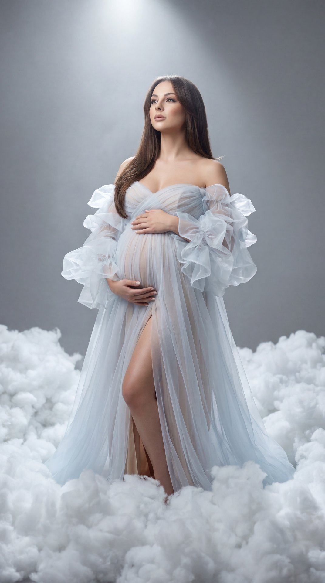 Ethereal studio maternity portrait, pregnant woman standing amid dense white faux clouds on a gray seamless, medium‑full shot, slight low angle, centered vertical frame; off‑shoulder sheer tulle gown in icy white/pale blue with voluminous organza ruffles 
